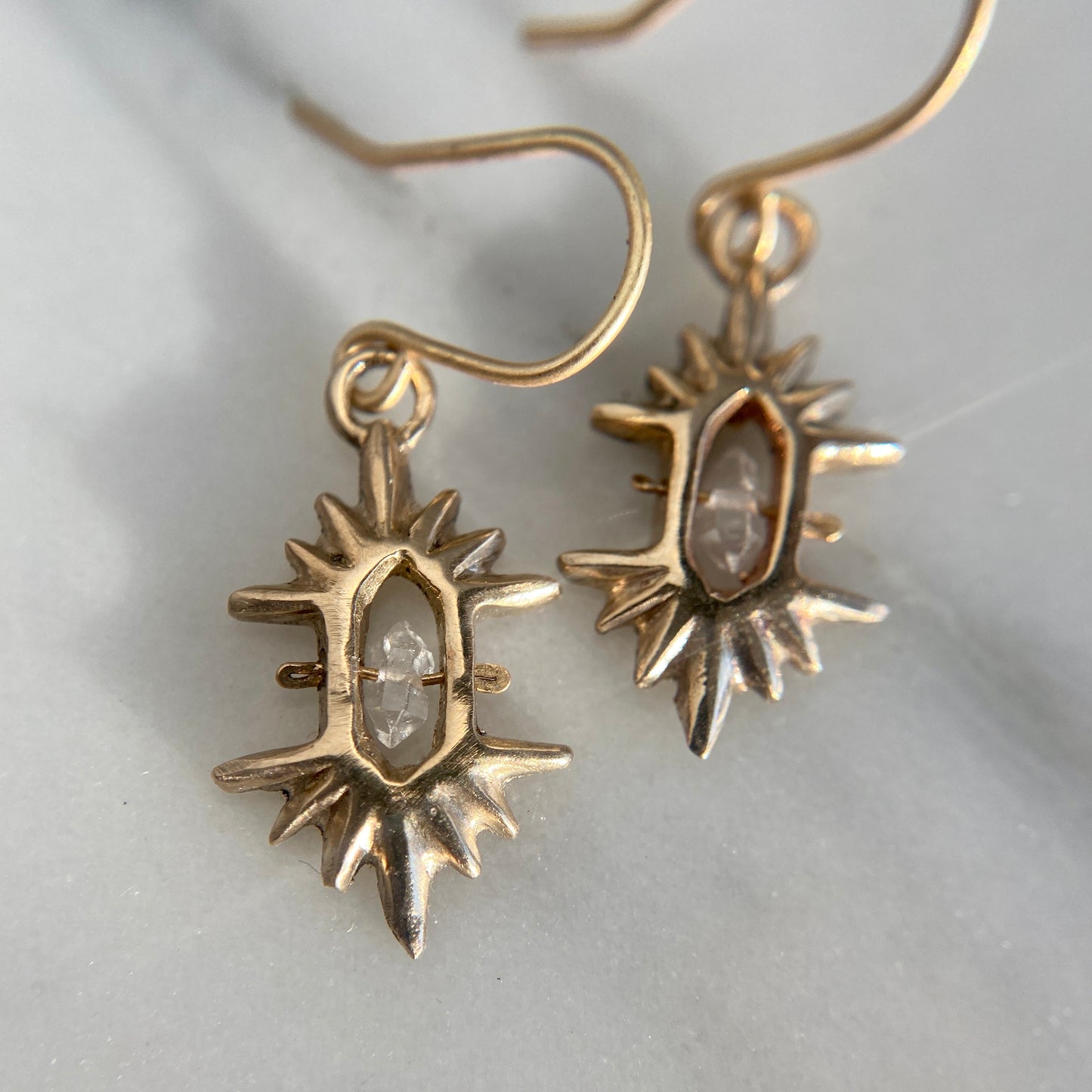 Crystal Sunburst Earrings in Gold tone bronze from Iron Oxide