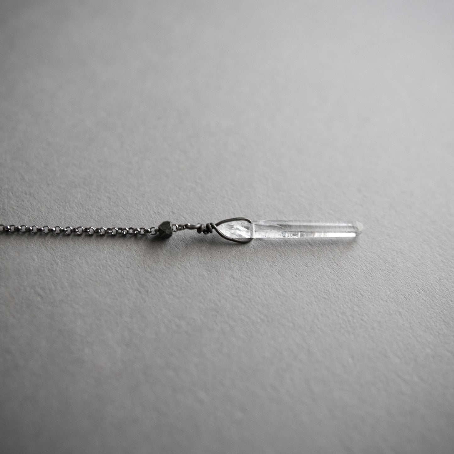 Labradorite lariat y necklace, close up on the crystal drop