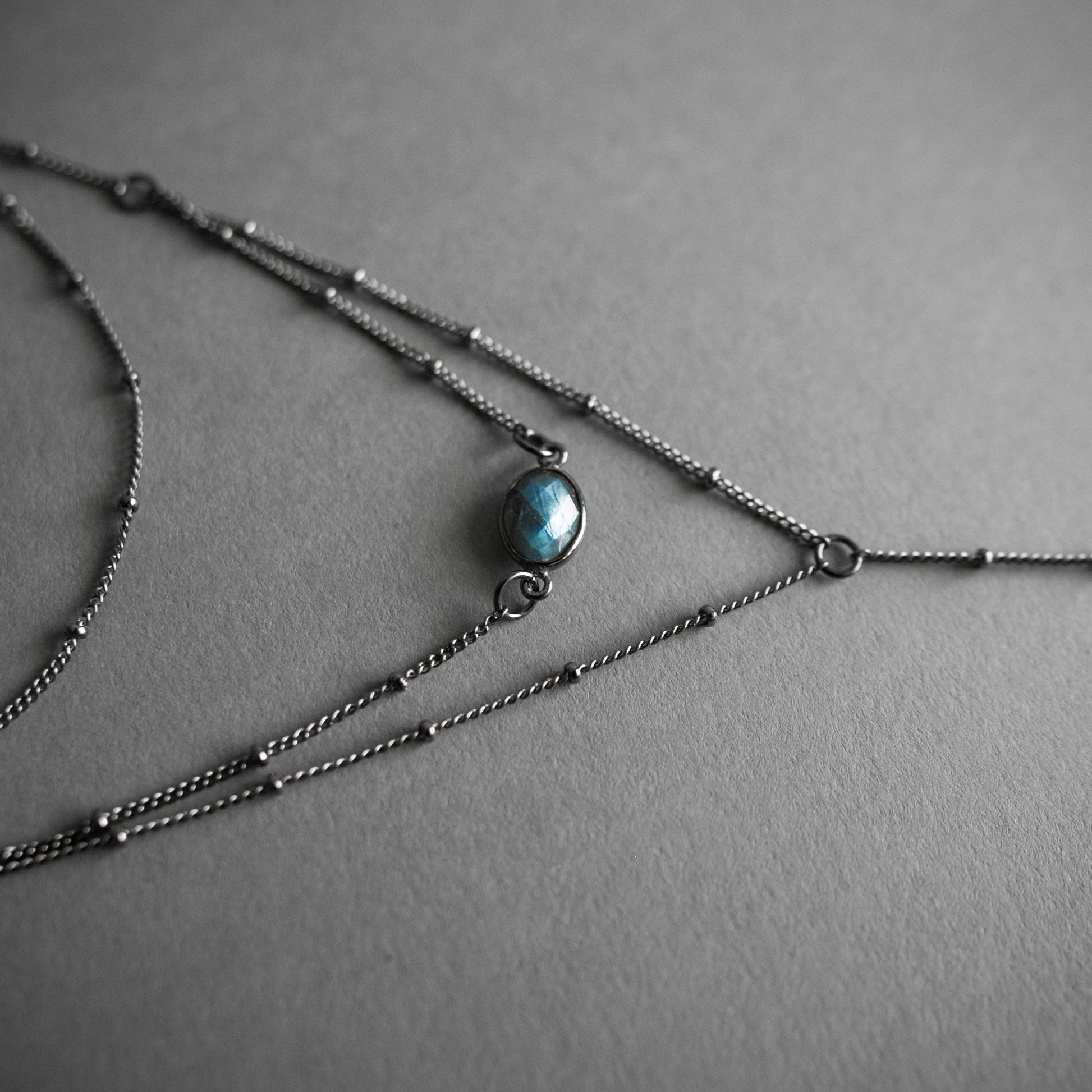 Layered Labradorite Lariat Necklace with crystal drop set on a dotted gunmetal chain