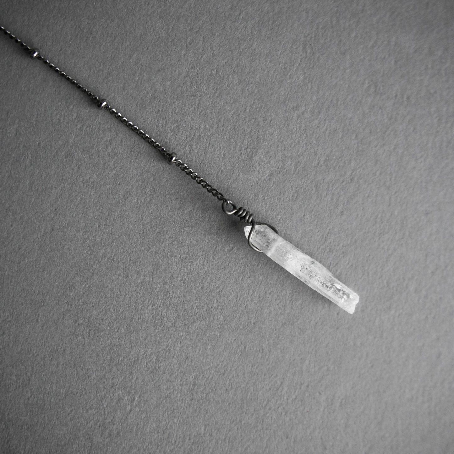 Layered Labradorite Lariat Necklace with crystal drop set on a dotted gunmetal chain