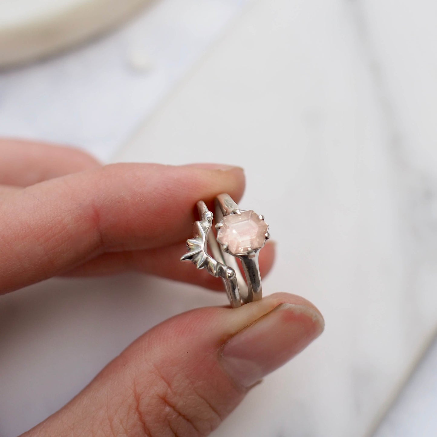 Sunstone Engagement Ring stacked with a Sunburst nesting band, sustainably mined jewelry handmade by Iron Oxide Designs Edit alt textSunstone Engagement Ring stacked with a Sunburst nesting band set in sterling silver, sustainably mined jewelry handmade by Iron Oxide Designs