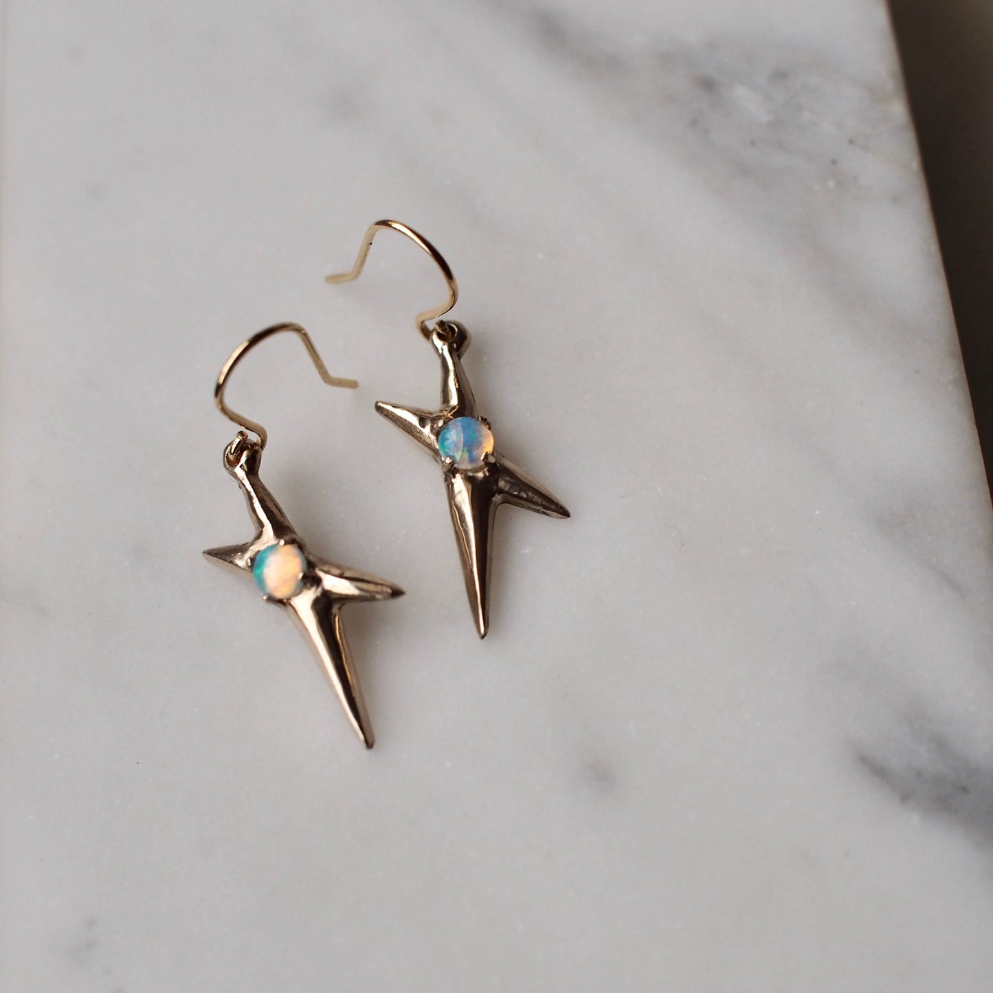 Spikey electric flash earrings set with sustainably sourced opal in gold tone