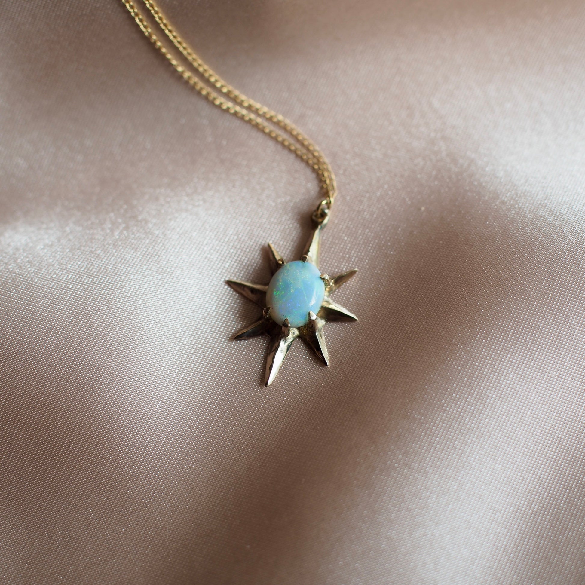 Close up of Supernova large star necklace set with lab grown opal