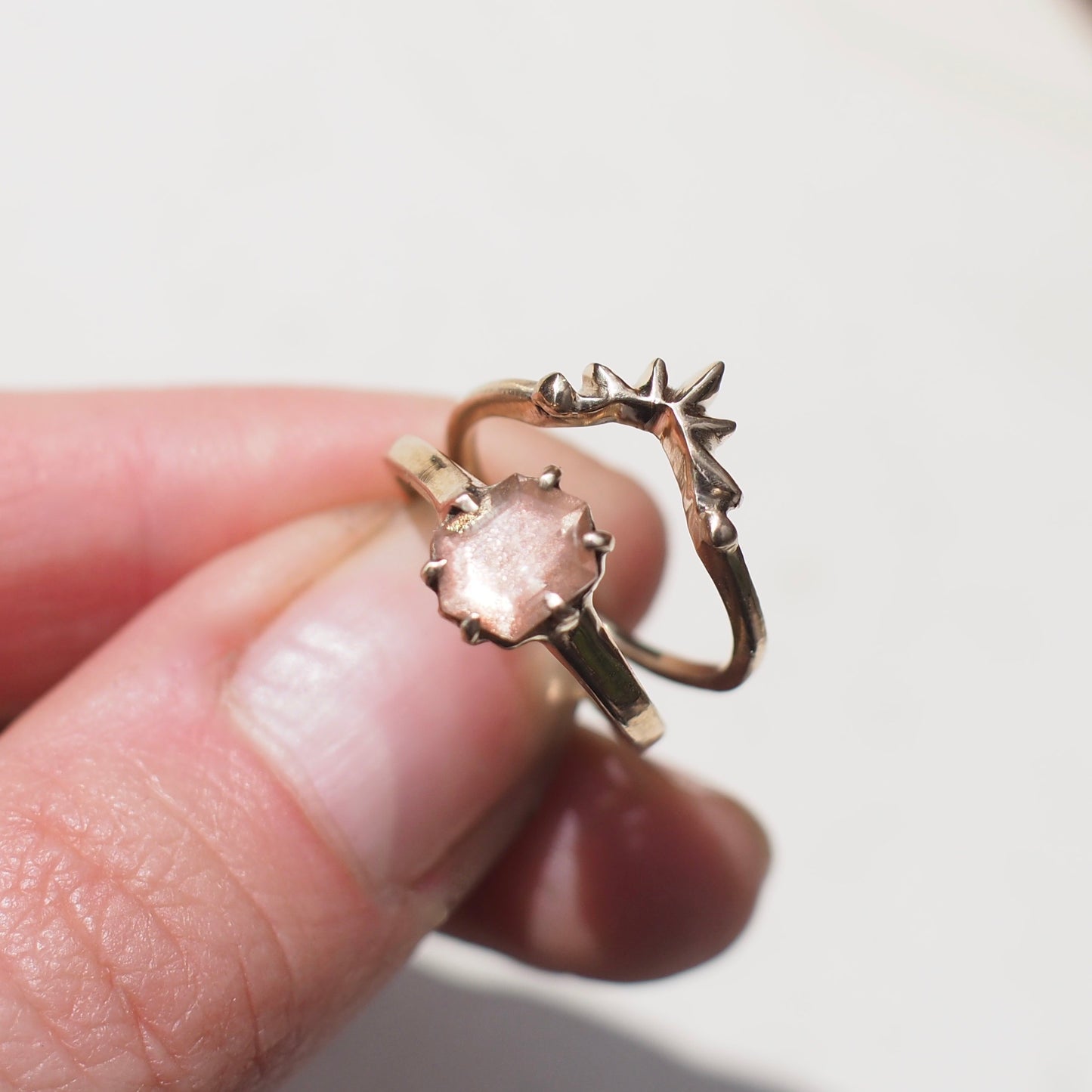 Diamond Alternative Wedding ring, sunstone hexagon ring stacked with the Sunburst nesting ring by Iron Oxide Designs
