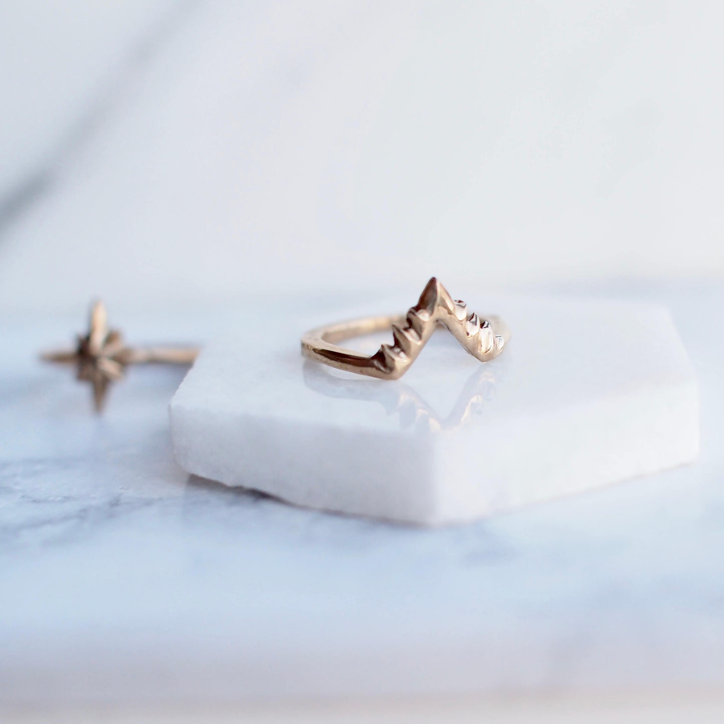 Celestial stacking ring band by Iron Oxide in gold tone bronze