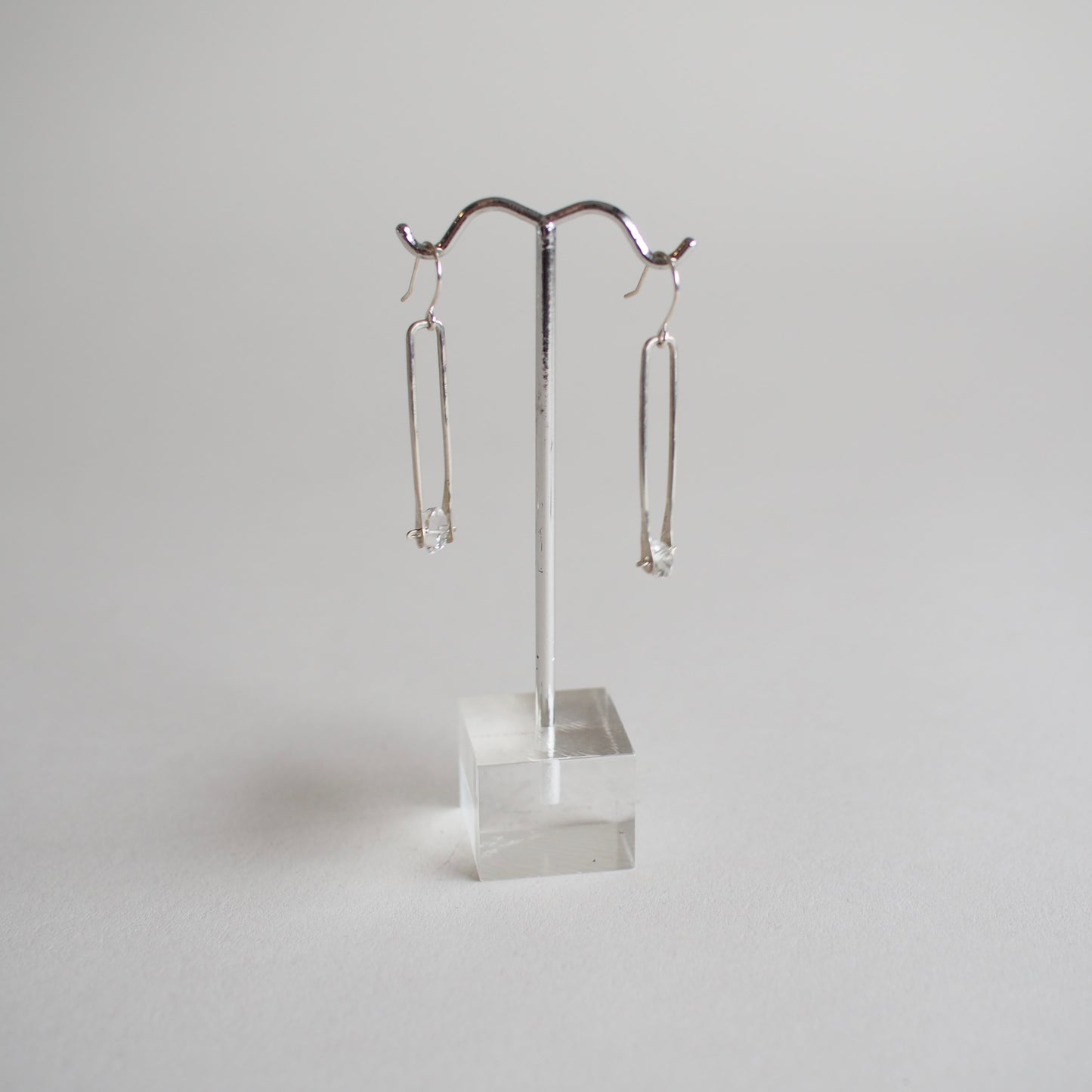 Minimalist silver frame crystal earrings by Iron Oxide