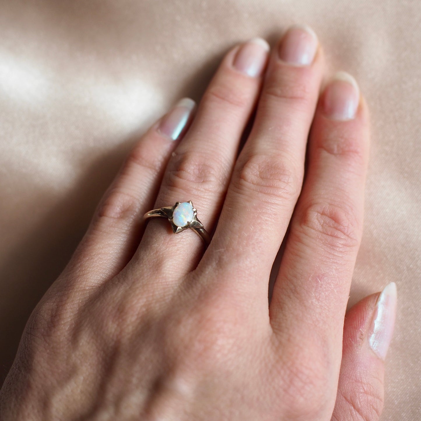 Stardust Opal ring set with ethically sourced natural Australian opal by Iron Oxide Designs on a model