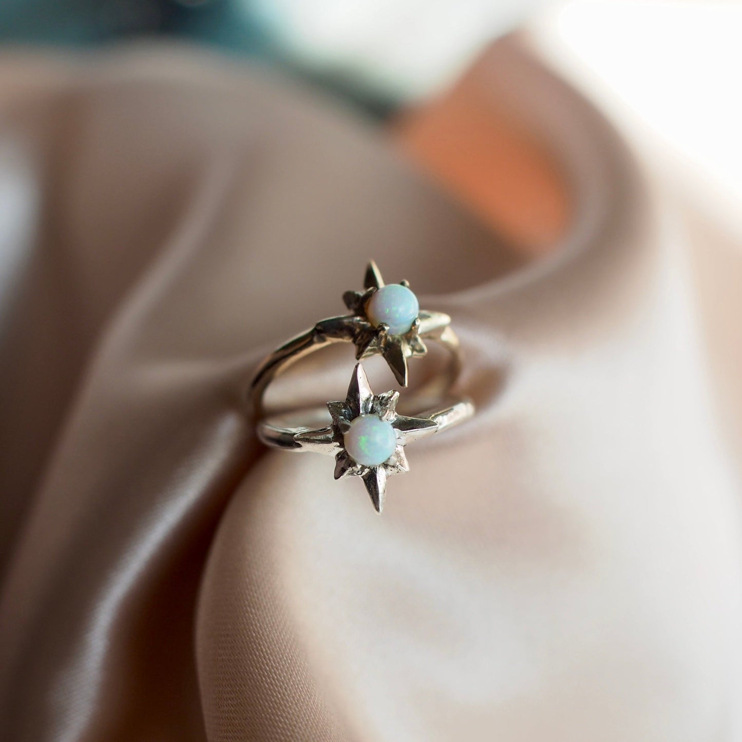 Polaris north star ring set with a tiny lab grown opal in sterling silver and gold tone bronze handmade by Iron Oxide Designs