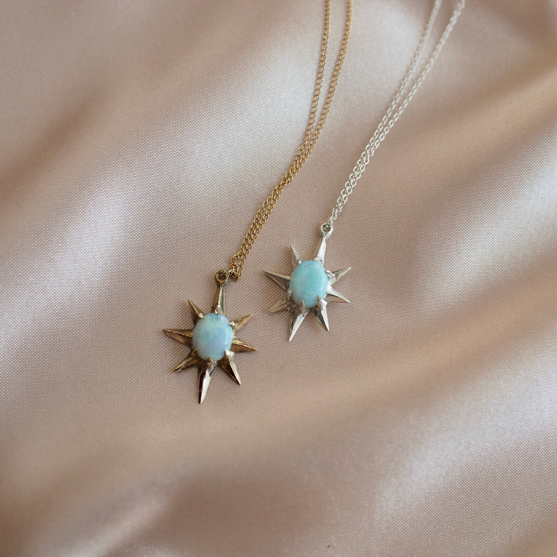 Supernova large star necklaces set with lab grown opals in sterling silver or gold tone bronze